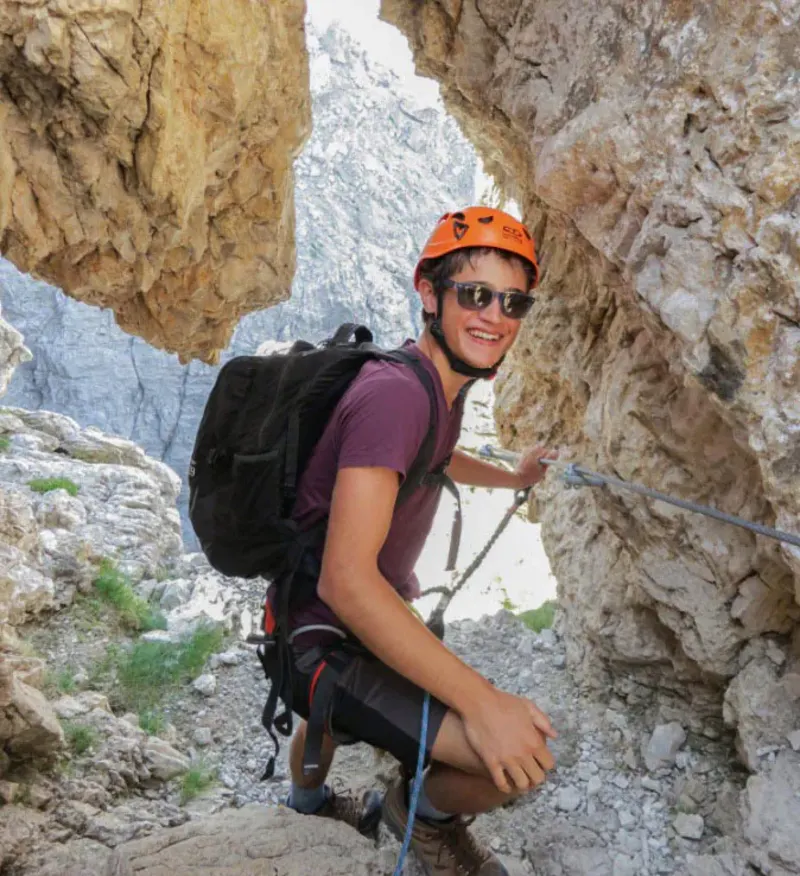 Student rock climbing in the alps