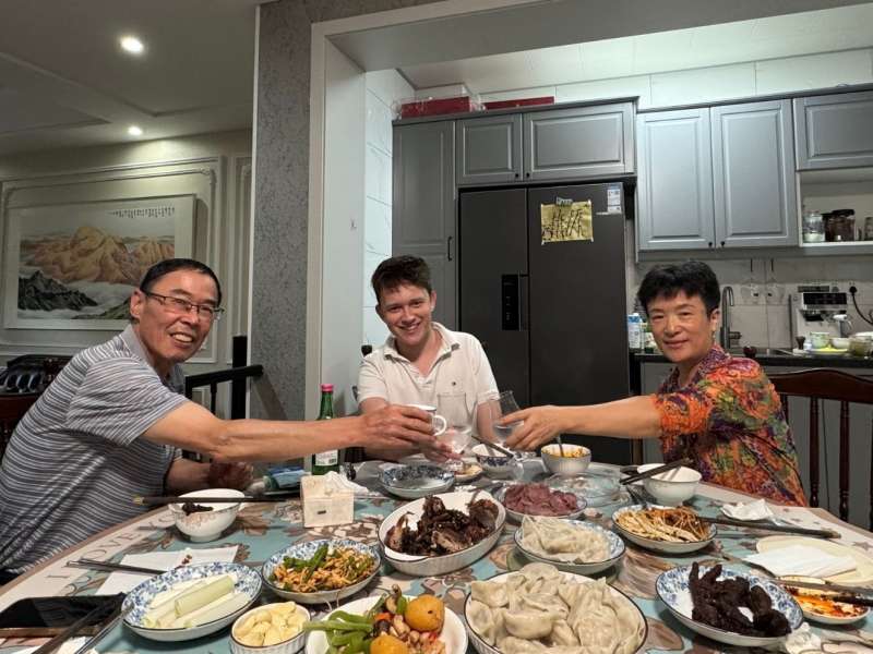 Student sharing a meal with his teacher and her family in Chengdu