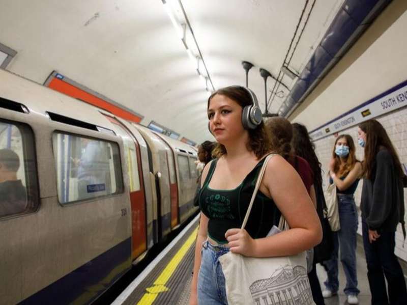 Student waiting for train on the Tube