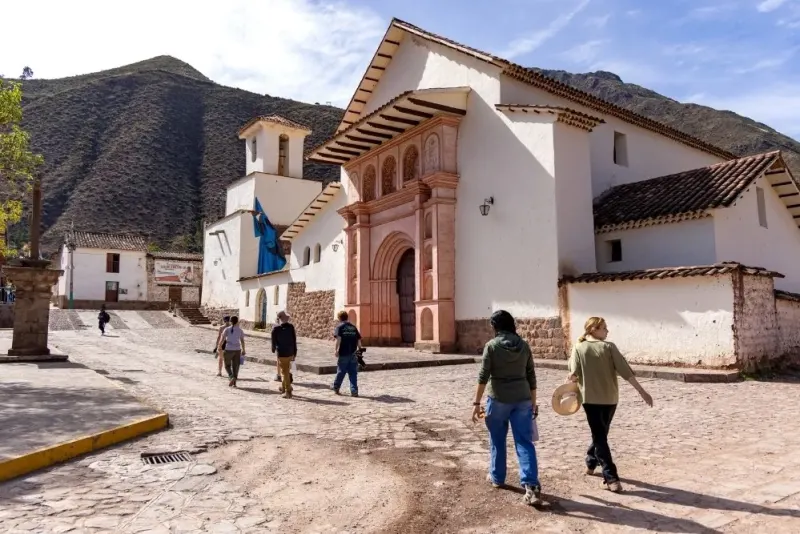 Student walk through town in Peru