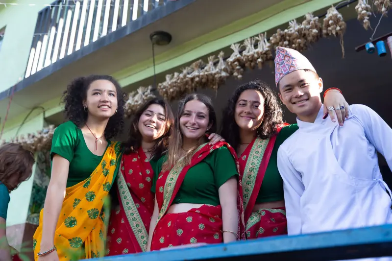 Student wear traditional local garbs