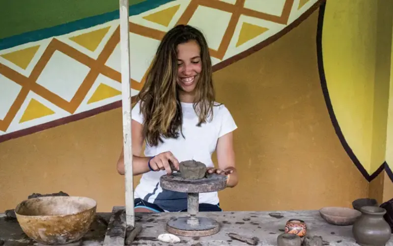 Student works with clay