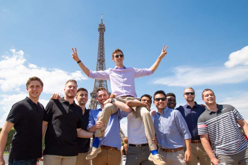 Students at the Eiffel Tower in Paris, an iconic landmark originally built for the 1889 World’s Fair and now one of the most visited monuments in the world.