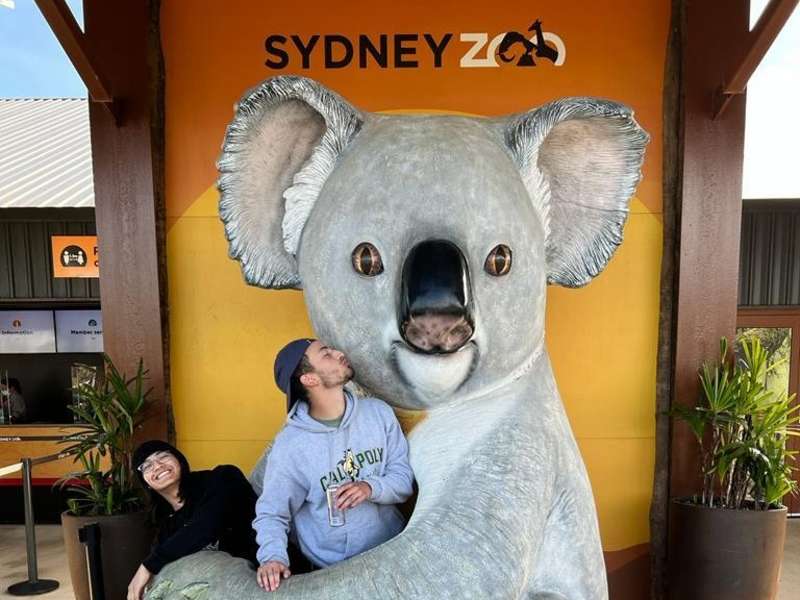 Students at the Sydney Zoo posing with a giant koala