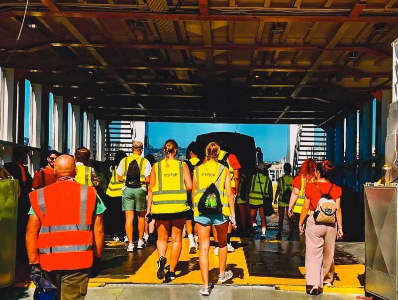 students boarding a boat for biology course
