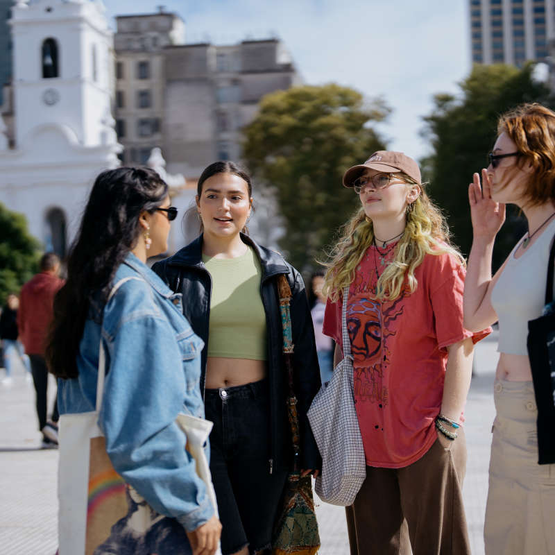 Students chat outside. 