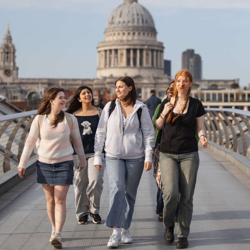 Students crossing a bridge in London.