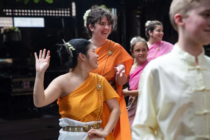 Students dancing with locals