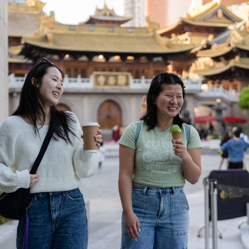 Students eat ice cream outside.