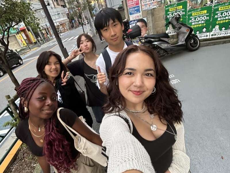 Students group selfie downtown Tokyo
