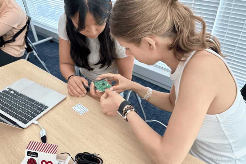 Students in class working with computer parts