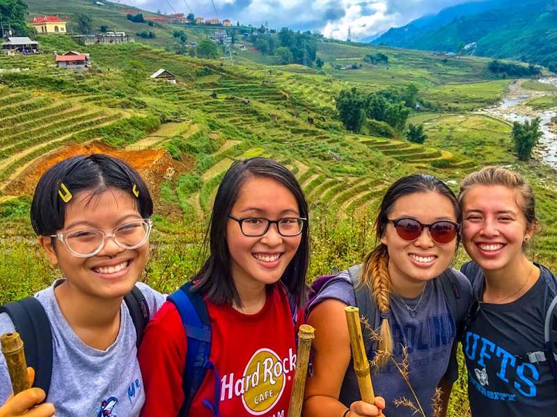 Students in front of rice fields in Vietnam
