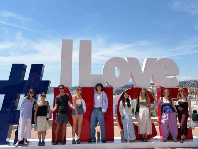 Students in front of sign in Nice