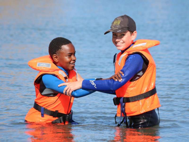 Students in life jackets ready to sail in Lüderitz