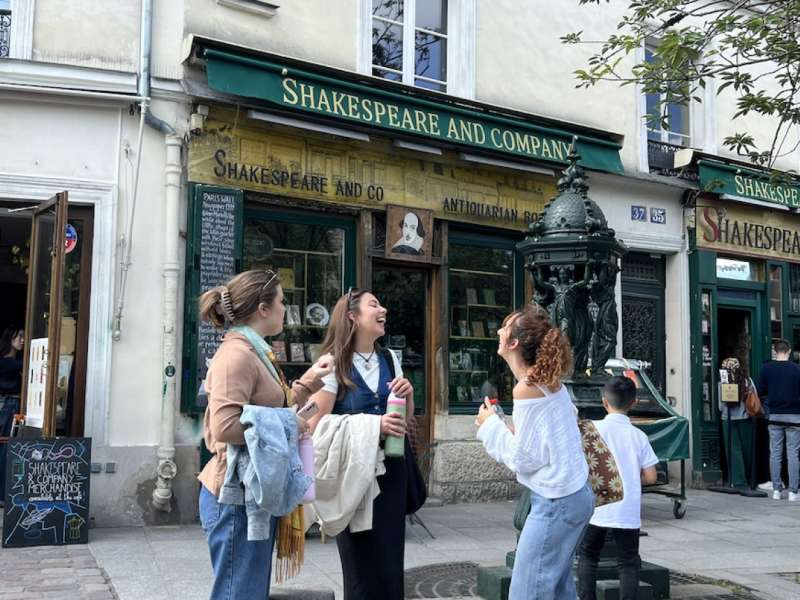 students laughing outside book shop