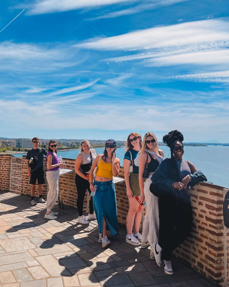 Students lined up overlooking the sea