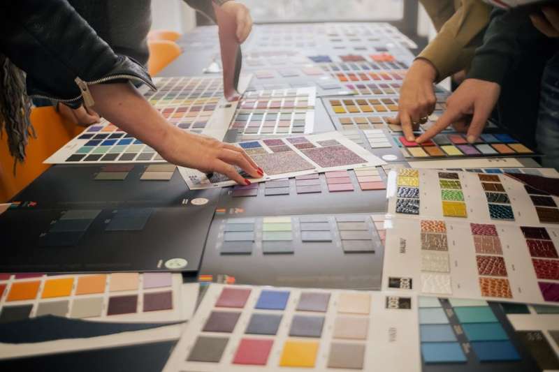 Students looking at color switches in class in Milan