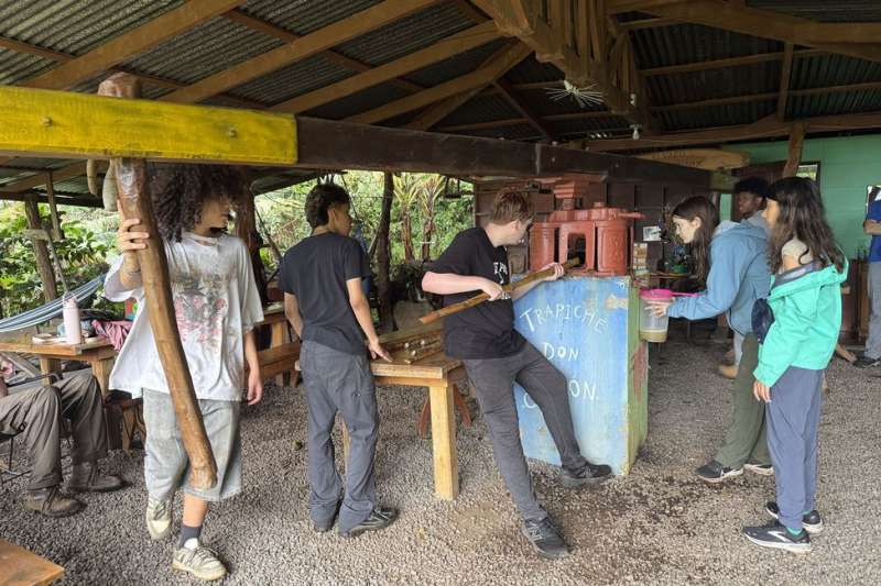 Students making sugar cane in Monteverde