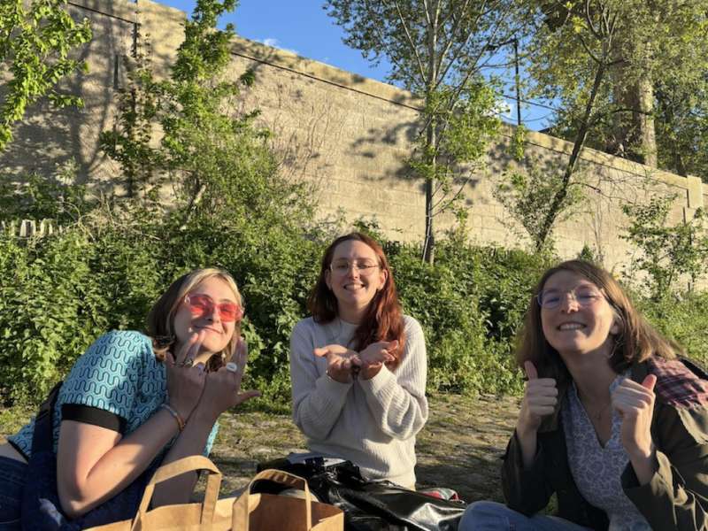 students picnic along the river