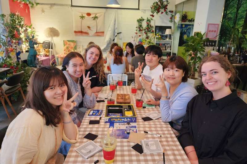Students playing board games while on program in Seoul