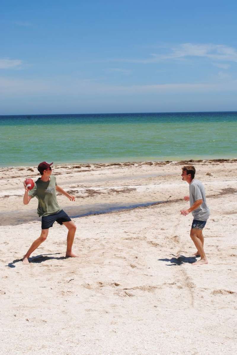 Students playing football on the beach in Yucatan