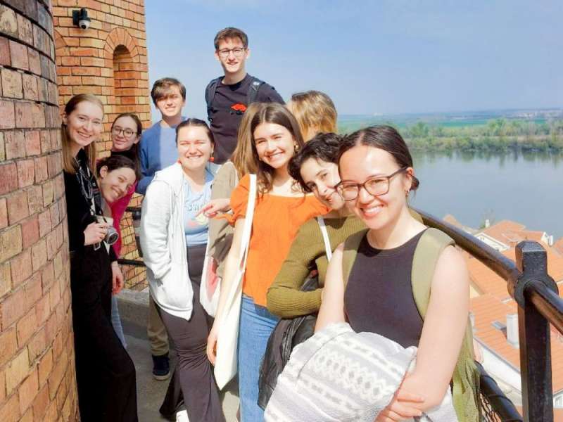 Students pose for a photo at the top of a tower
