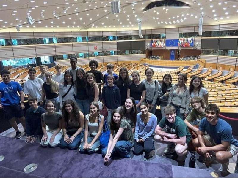 Students posing in EU Parliament building in Brussels