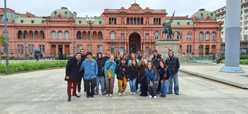 Students posing in front of historic building in Buenos Aires