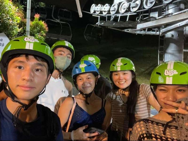 Students posing in front of Skyride in Singapore