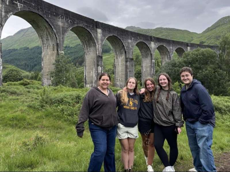 Students posing in front of the viaduct in Scotland