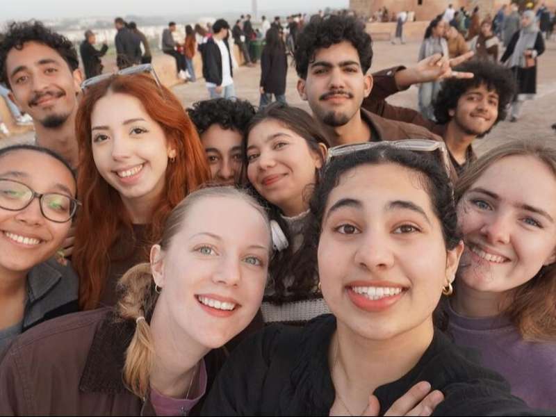 Students posing in group in square in Rabat
