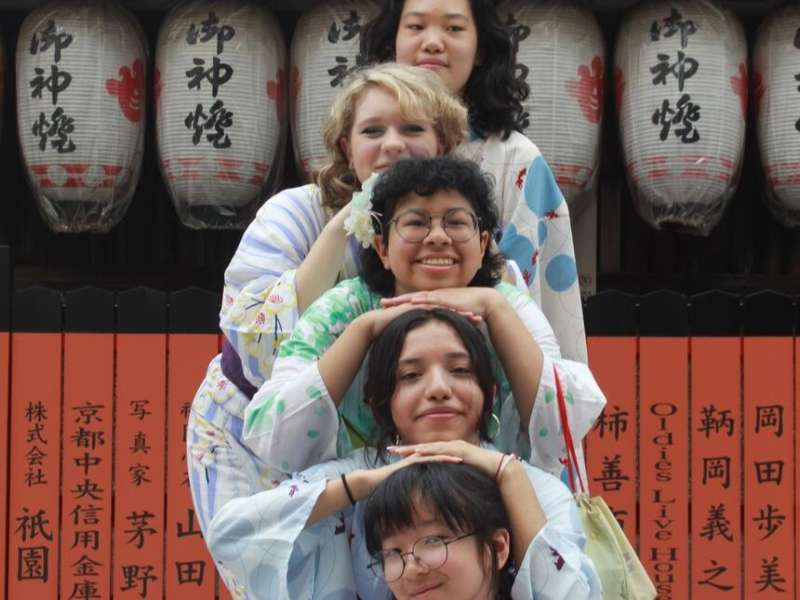 Students posing in traditional yukatas in Kyoto