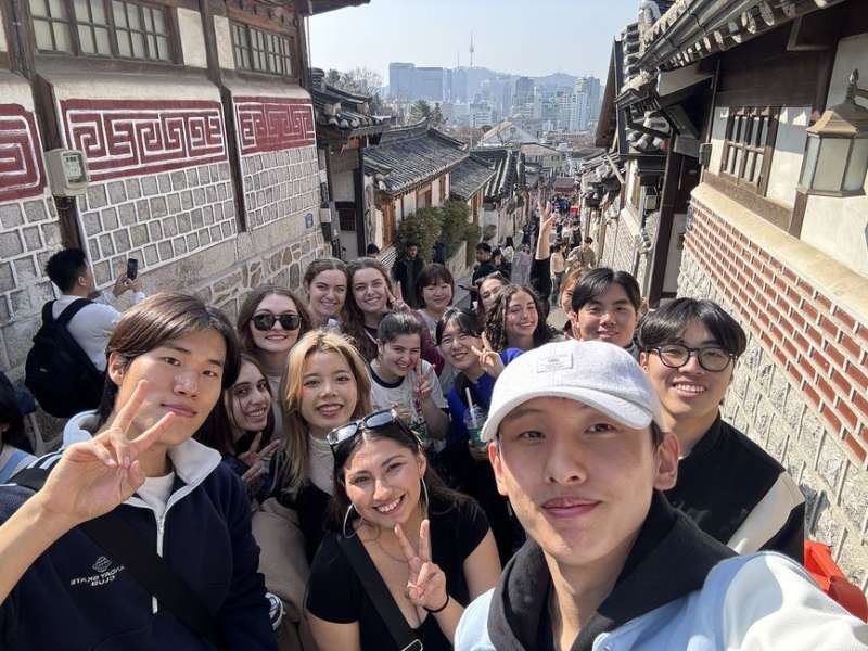 Students posing on street in Seoul