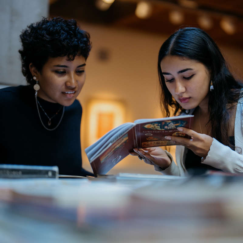 Students read a book. 