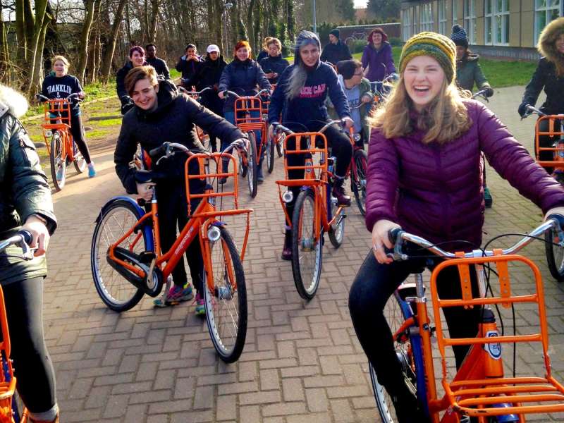 Students riding bicycles in Amsterdam