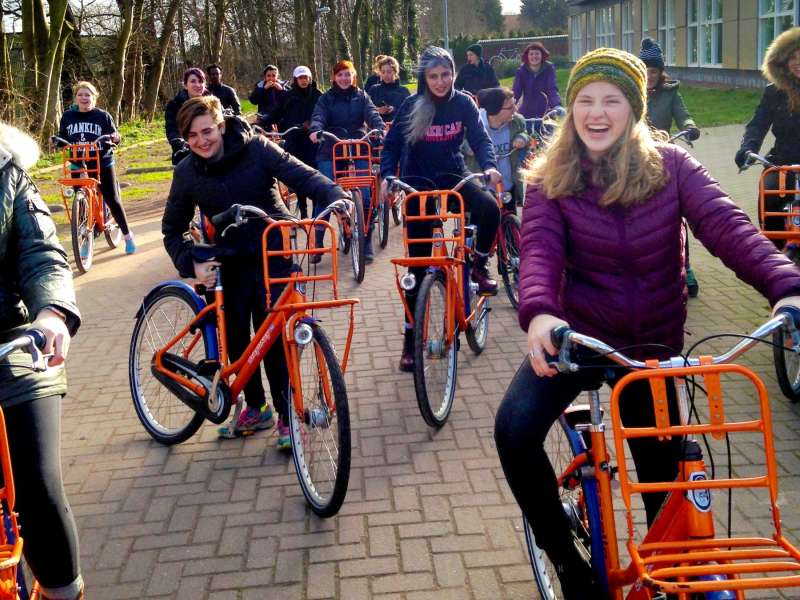 Students riding bikes in Amsterdam