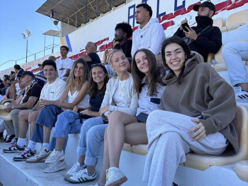 Students sitting in stands at soccer stadium in Lisbon