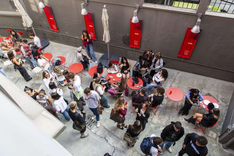 Students socialising outside their school building