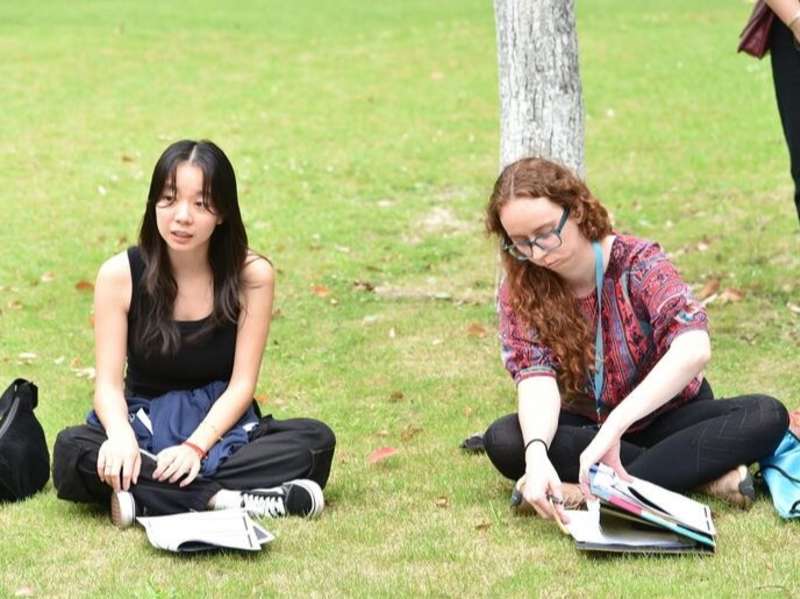Students studying in park in China