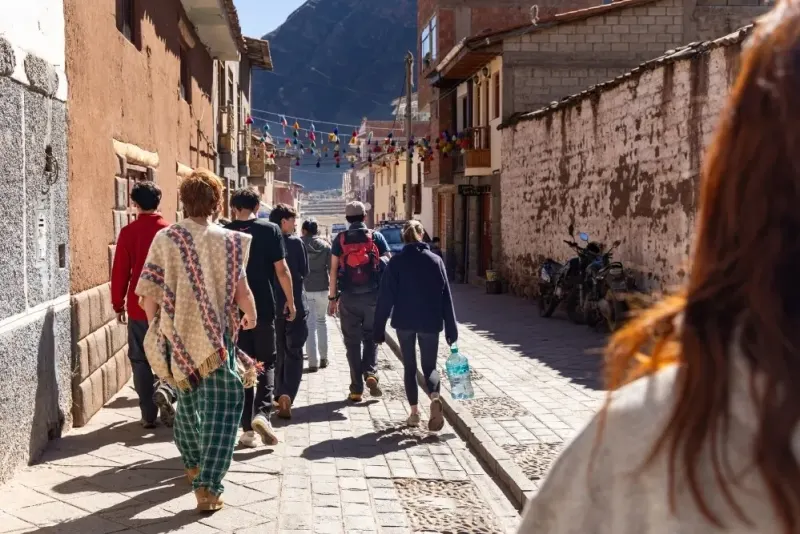 Students walk streets in Peru
