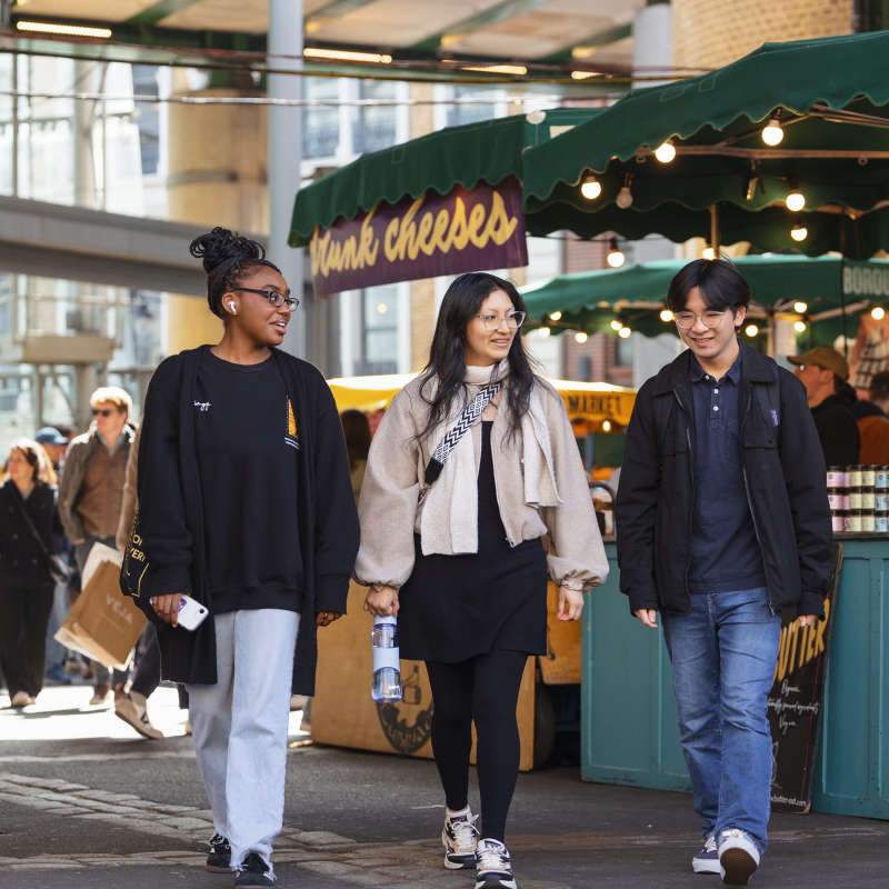 Students walking in the market.