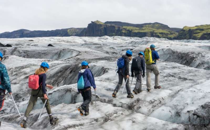 students walking on glacier
