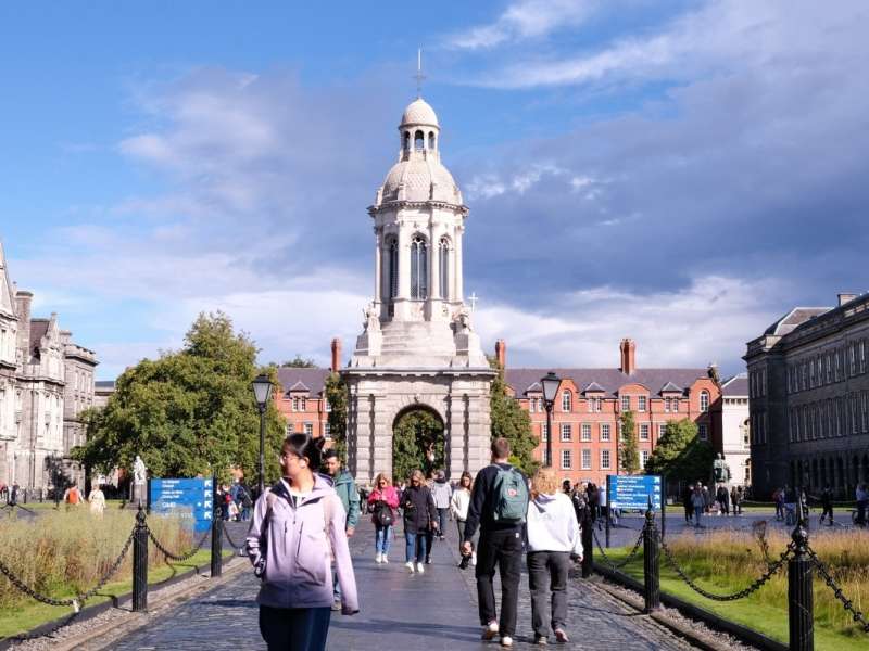 Students walking on Trinity campus on a sunny day