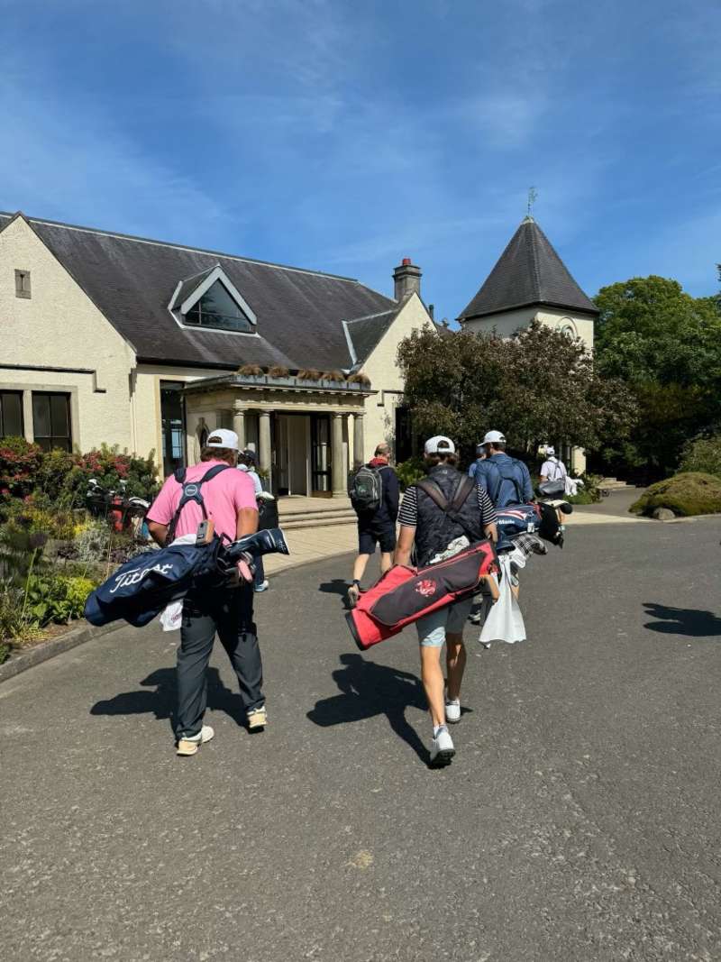 Students walking with golf bags to classroom in Scotland