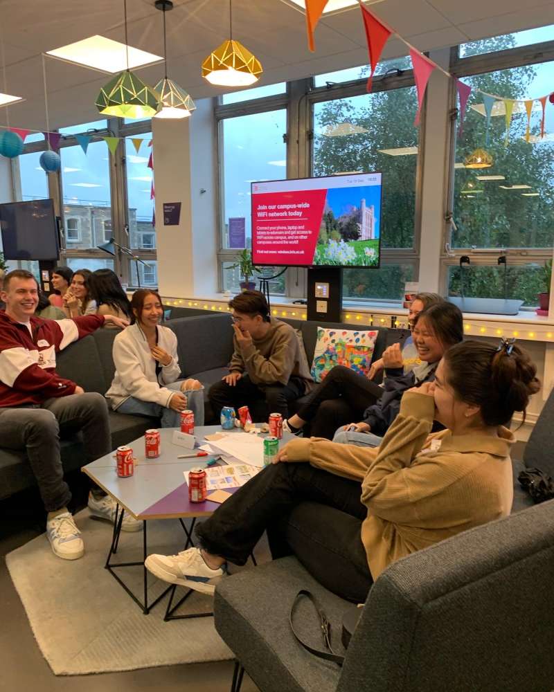 Study Abroad students sitting in a group laughing