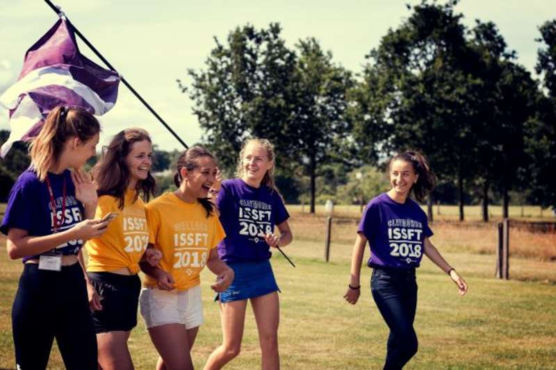 summer school students waving a flag