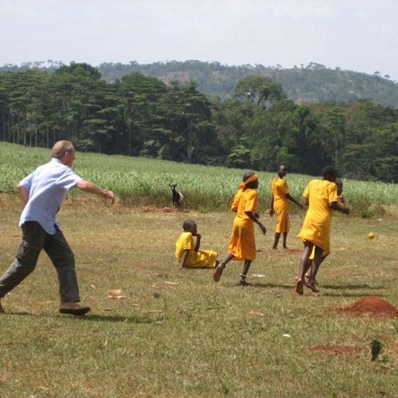Volunteer playing sports with school children in Uganda, Africa