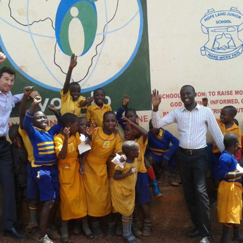 Volunteer with his students in rural Uganda, Africa