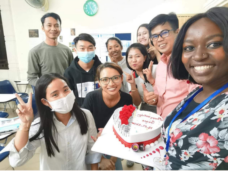 Teacher and sudents celebrating