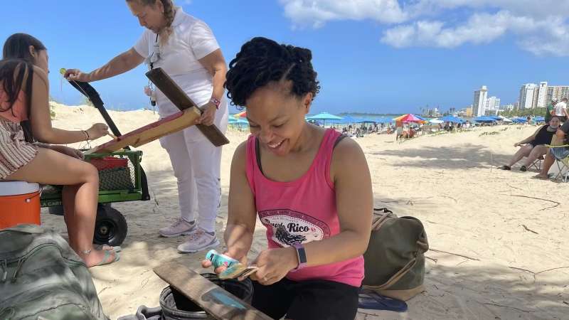 Teen Volunteers Painting and Making Signs for a Beach in Puerto Rico